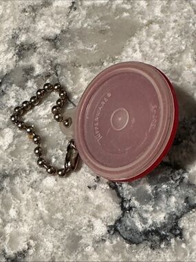 Vintage TUPPERWARE collectible fashion accessory Keychain, approximately 1 1/2”